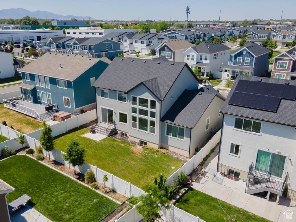 Aerial view of residential area with a mountainous background