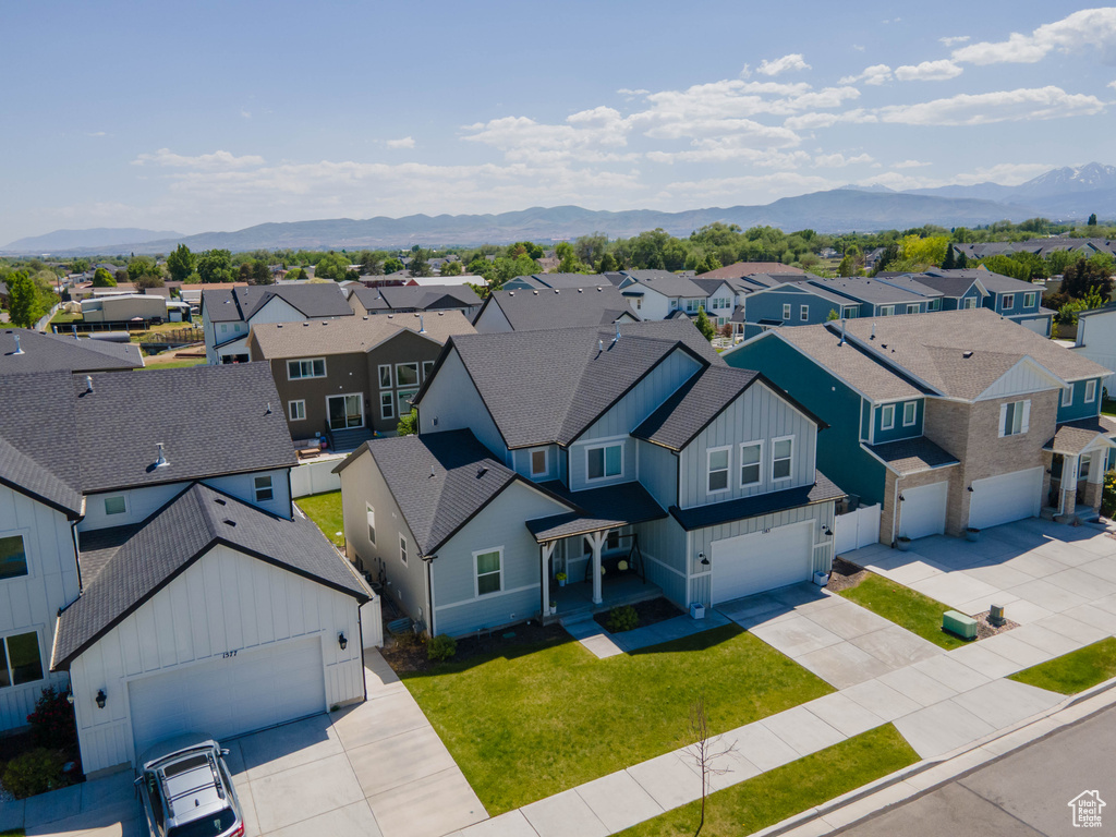 Aerial view of residential area featuring a mountainous background
