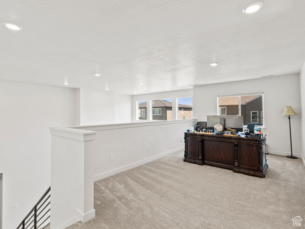 Office featuring light carpet, baseboards, and recessed lighting