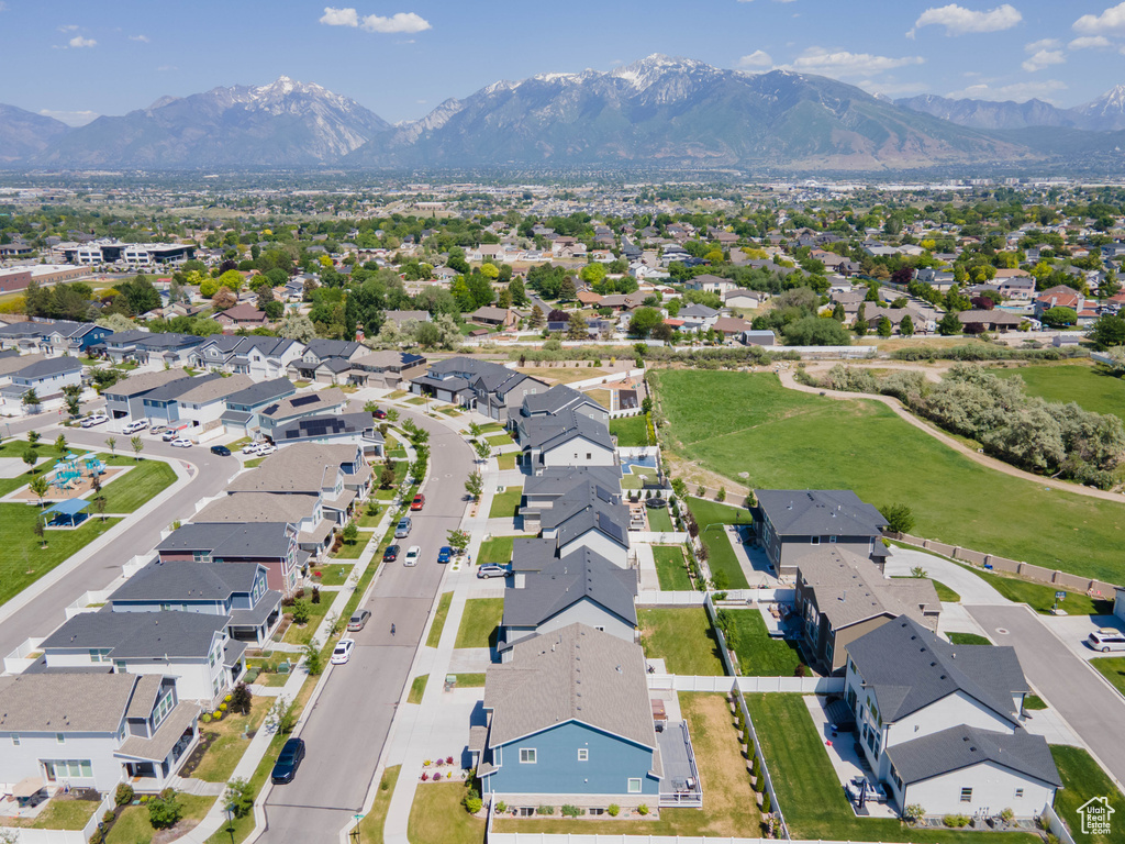 Aerial perspective of suburban area featuring a mountain backdrop