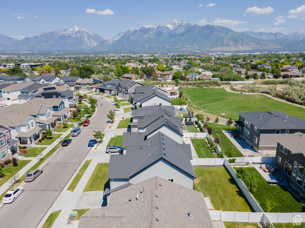 Aerial perspective of suburban area featuring a mountainous background