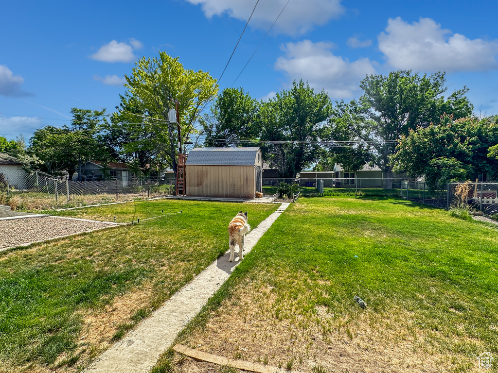 View of yard with an outbuilding