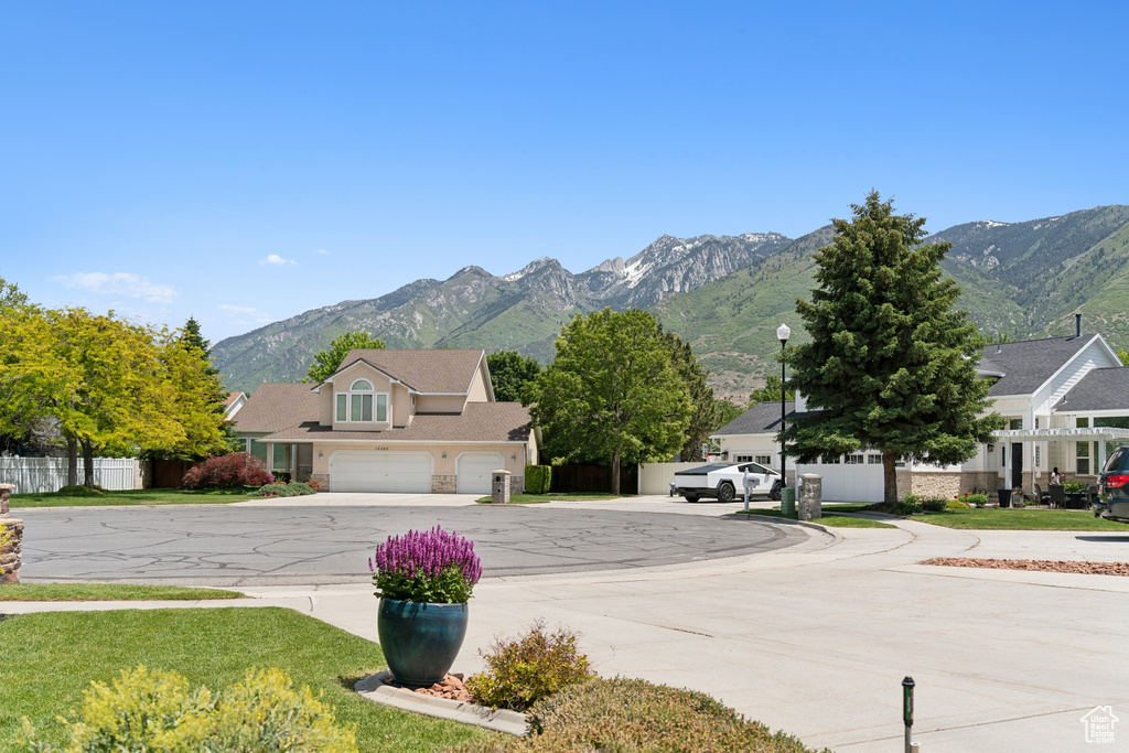 View of road with a mountain view and street lights