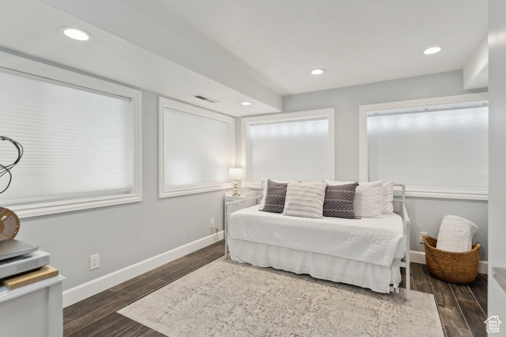 Bedroom featuring wood finished floors, baseboards, and recessed lighting