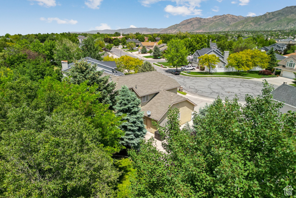 Aerial view of residential area featuring mountains