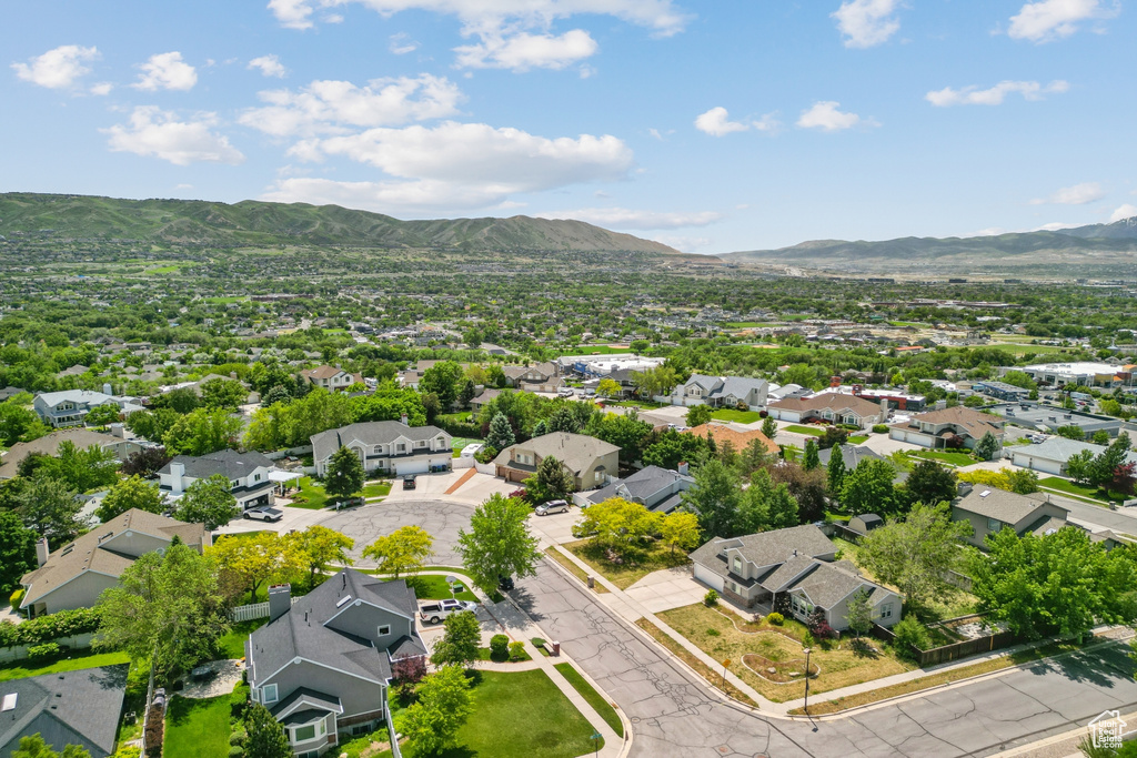 Aerial view of residential area featuring mountains
