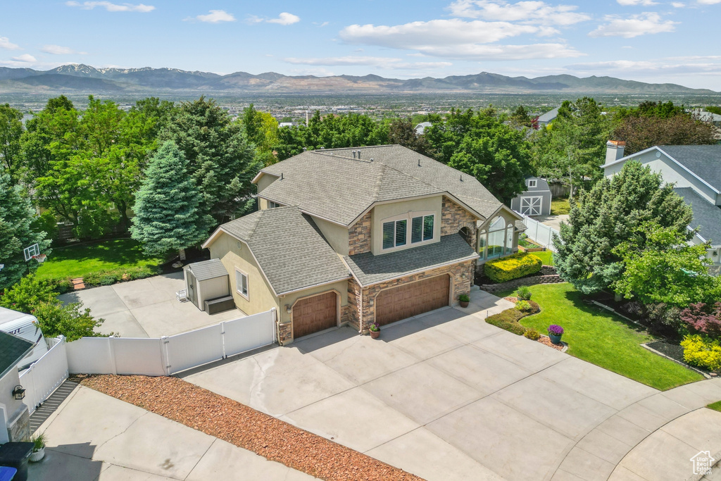 View from above of property with a mountain backdrop
