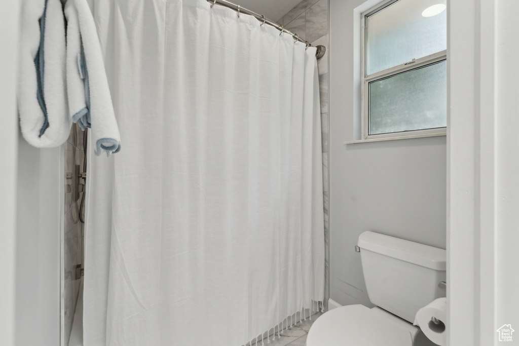 Full bathroom featuring toilet