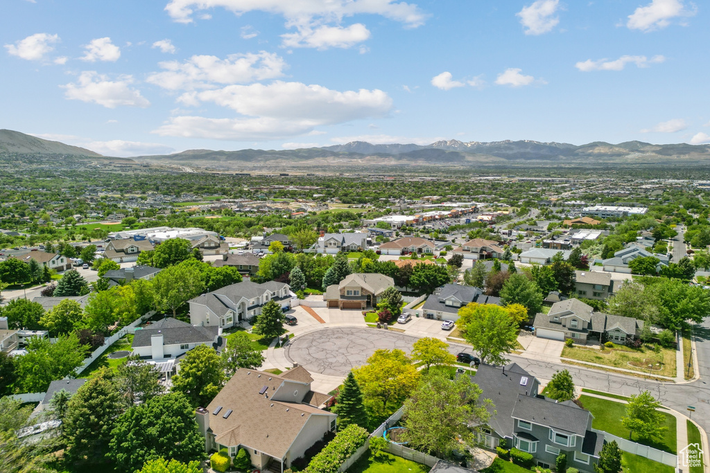 Aerial view of residential area featuring a mountainous background
