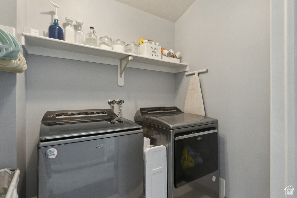 Laundry area featuring washing machine and clothes dryer