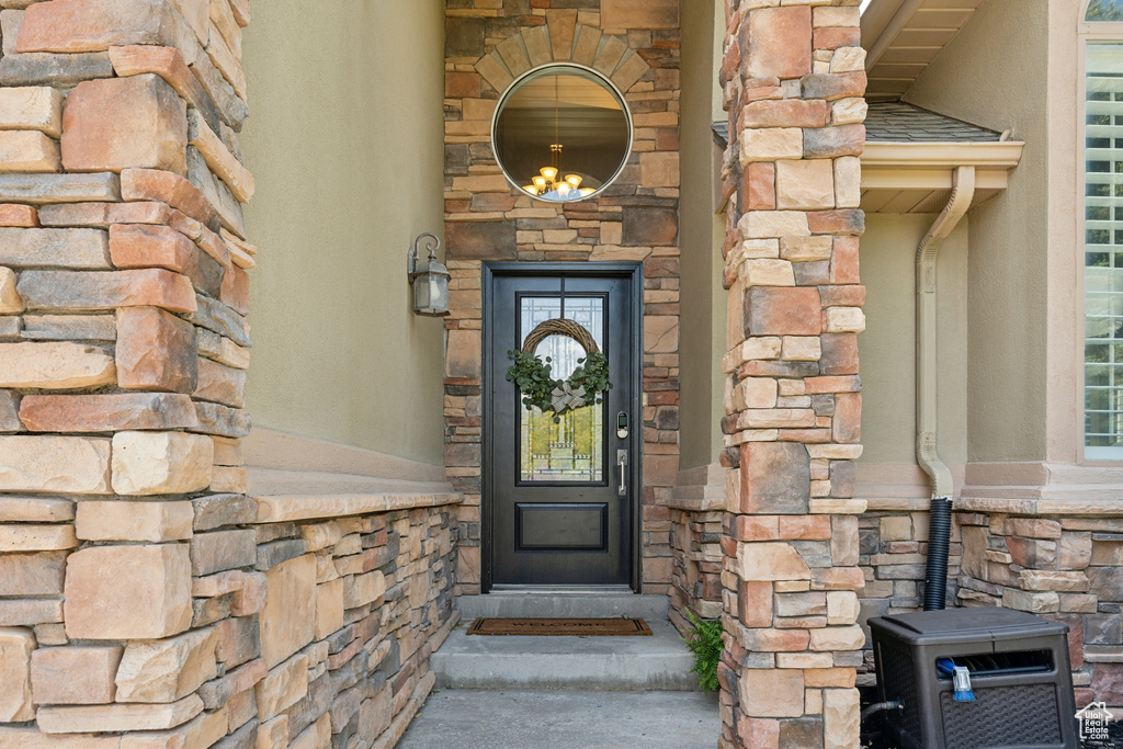 View of exterior entry with stone siding