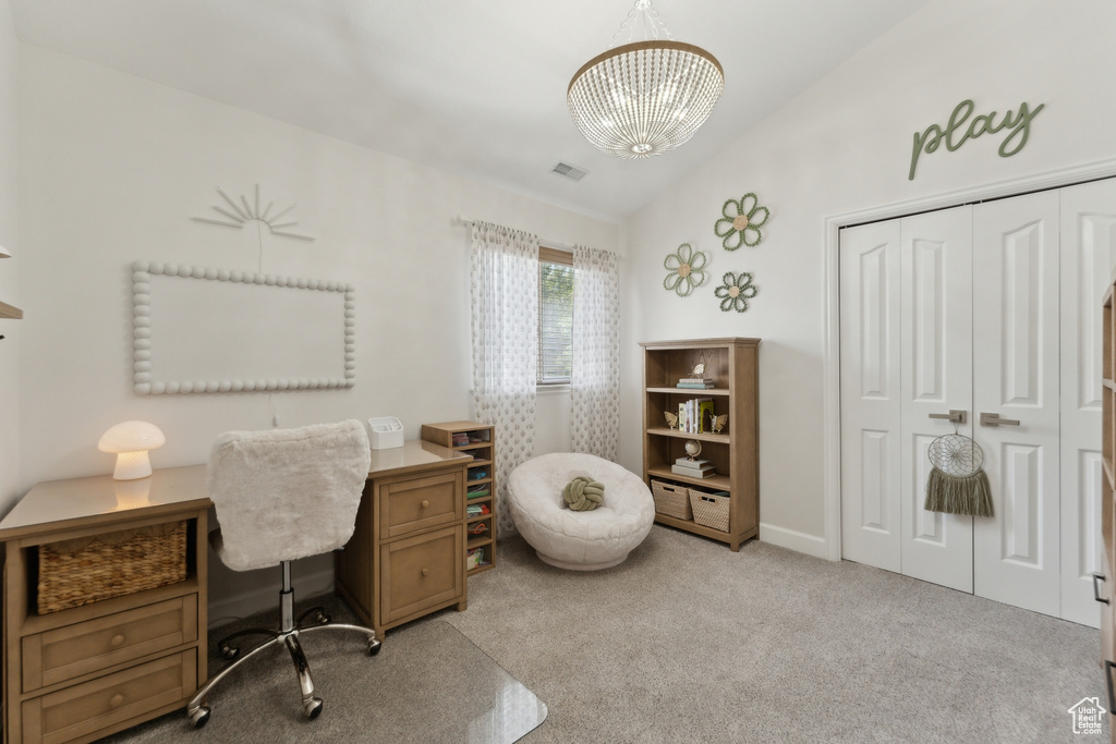 Carpeted office with a chandelier and lofted ceiling