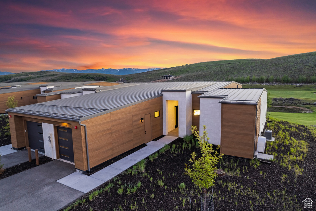 Modern home with a standing seam roof, metal roof, and a mountain view