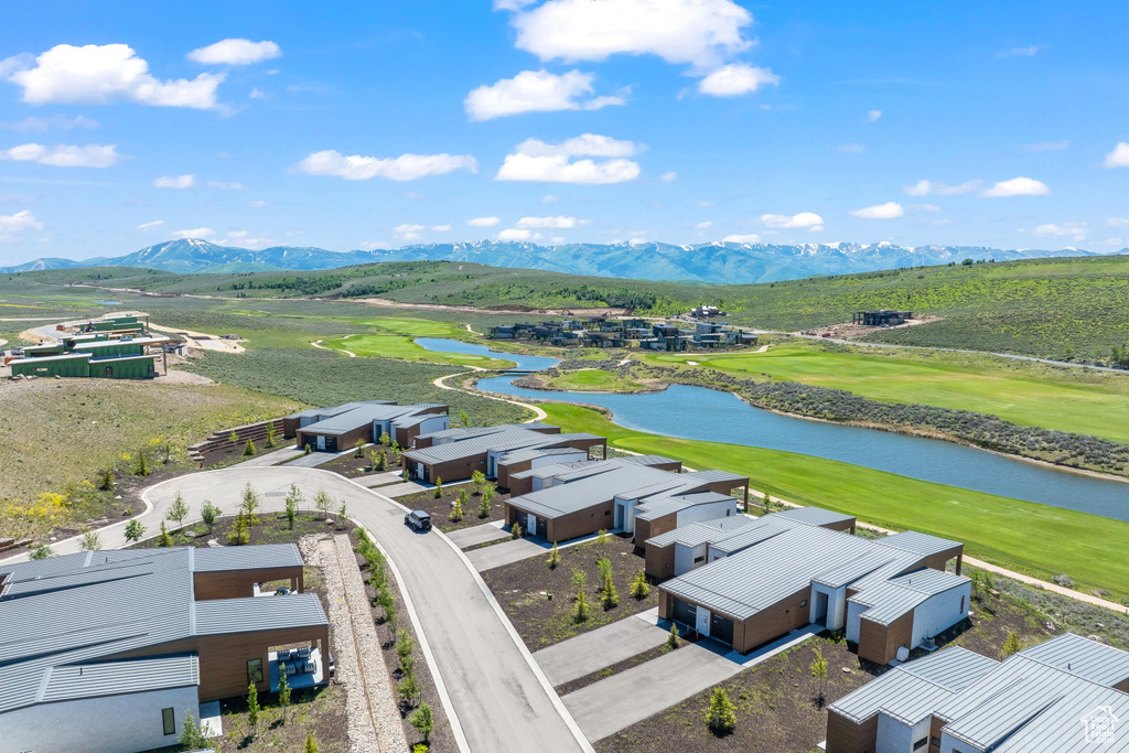 Aerial view of a water and mountain view and a golf course