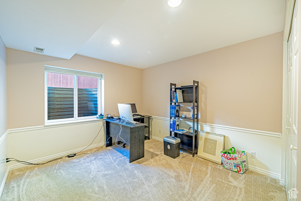 Carpeted office space featuring baseboards and recessed lighting