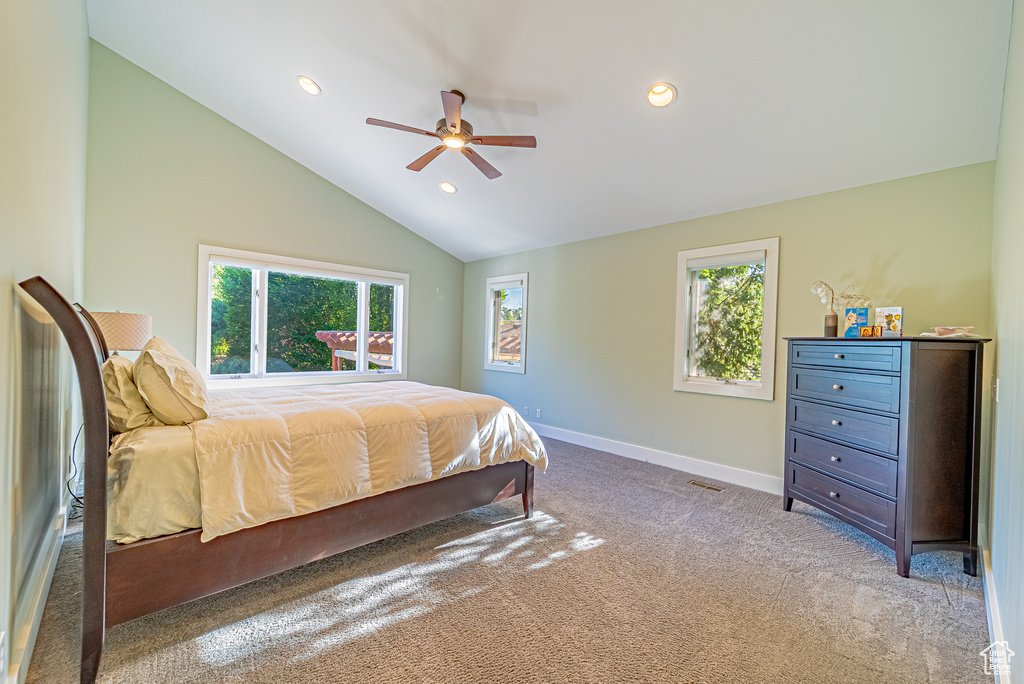 Carpeted bedroom with vaulted ceiling, baseboards, recessed lighting, and ceiling fan