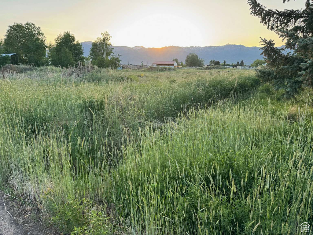 View of mountain backdrop featuring rural landscape