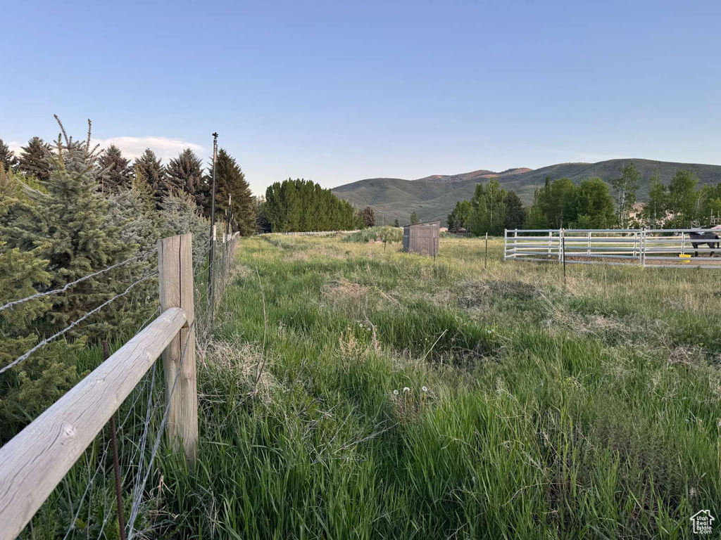View of mountain background featuring rural landscape
