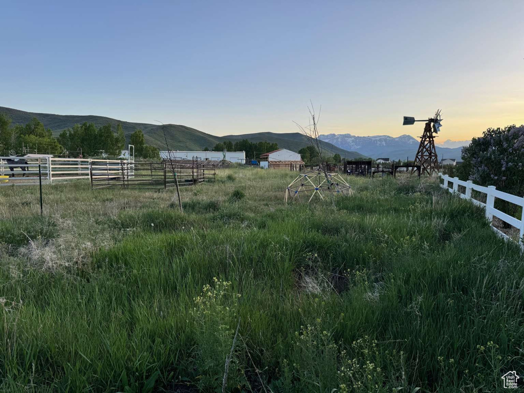 View of yard with a mountain view and a view of countryside