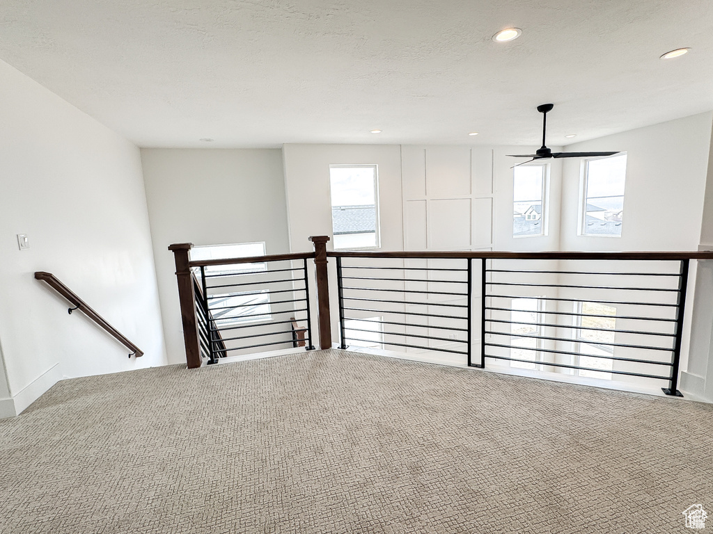 Empty room with carpet flooring, a ceiling fan, and recessed lighting