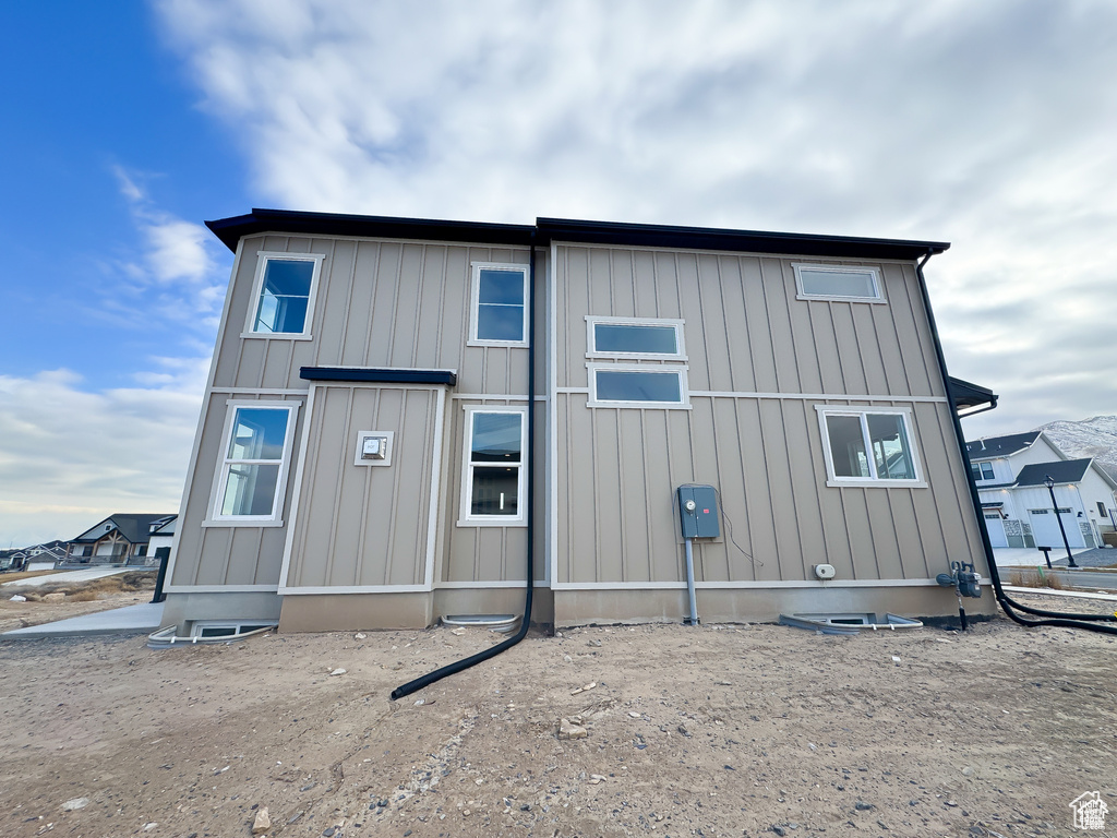 Back of property featuring board and batten siding