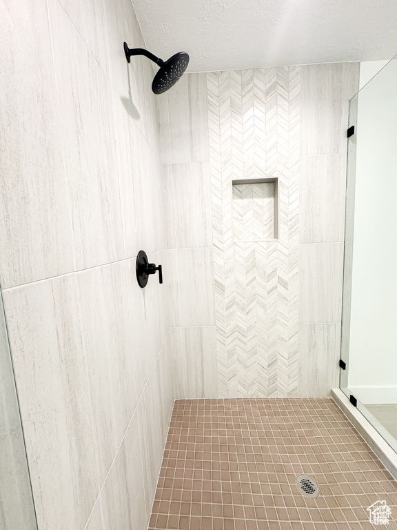 Full bathroom with a tile shower