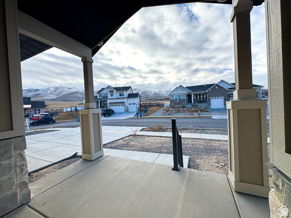 View of patio / terrace featuring a mountain view and a residential view