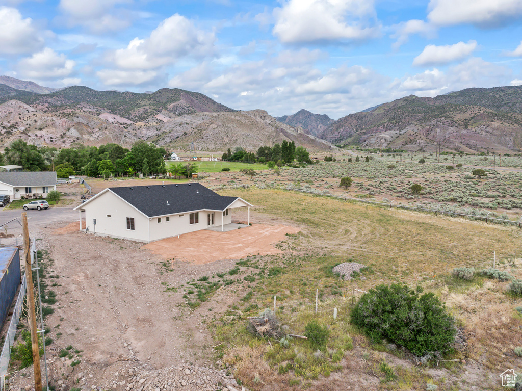 View of mountain background featuring rural landscape