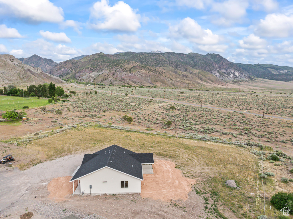 Overview of rural landscape featuring a mountainous background