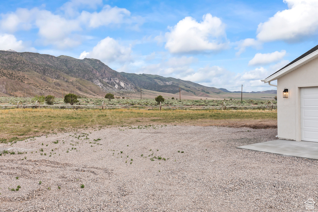 View of mountain background featuring rural landscape