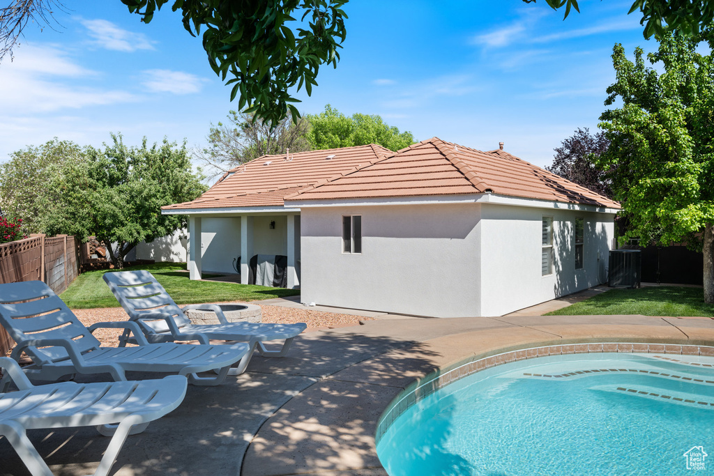 View of swimming pool featuring a patio area and central AC unit