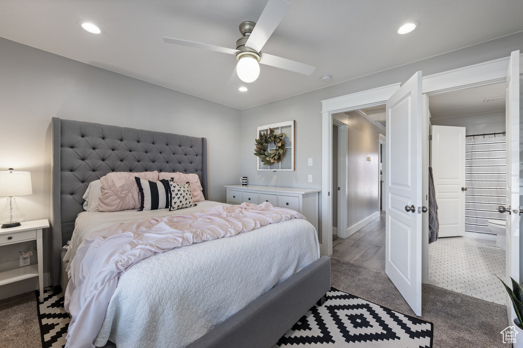 Carpeted bedroom with recessed lighting and a ceiling fan