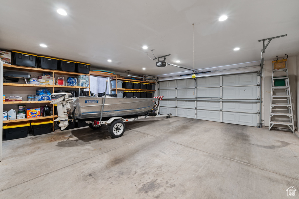 Garage with a garage door opener and recessed lighting