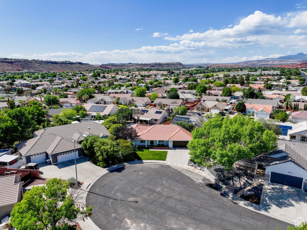 Aerial perspective of suburban area with a mountainous background