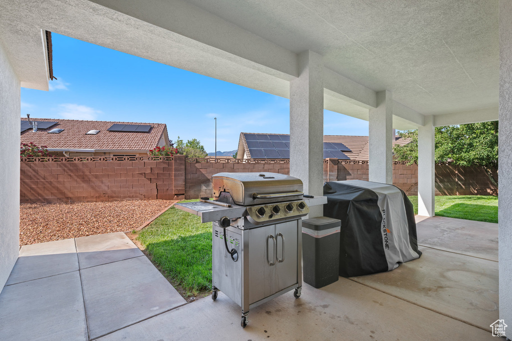 Fenced backyard with a patio area and area for grilling