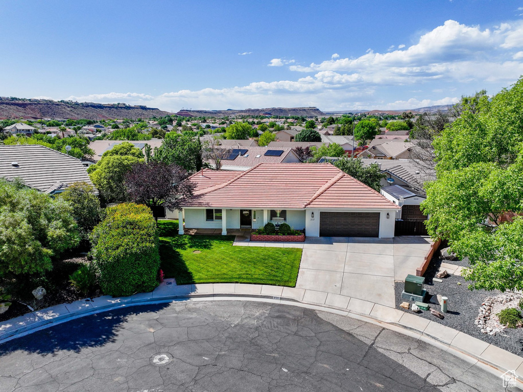 Aerial view of residential area with a mountain backdrop