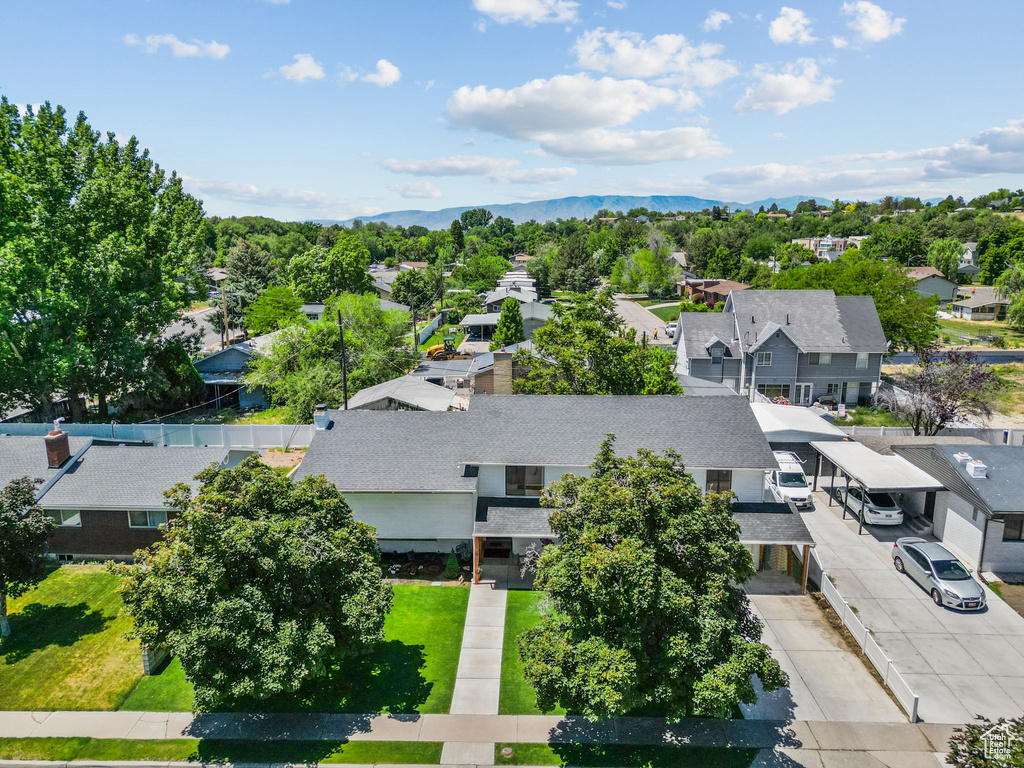 Aerial perspective of suburban area with a mountainous background