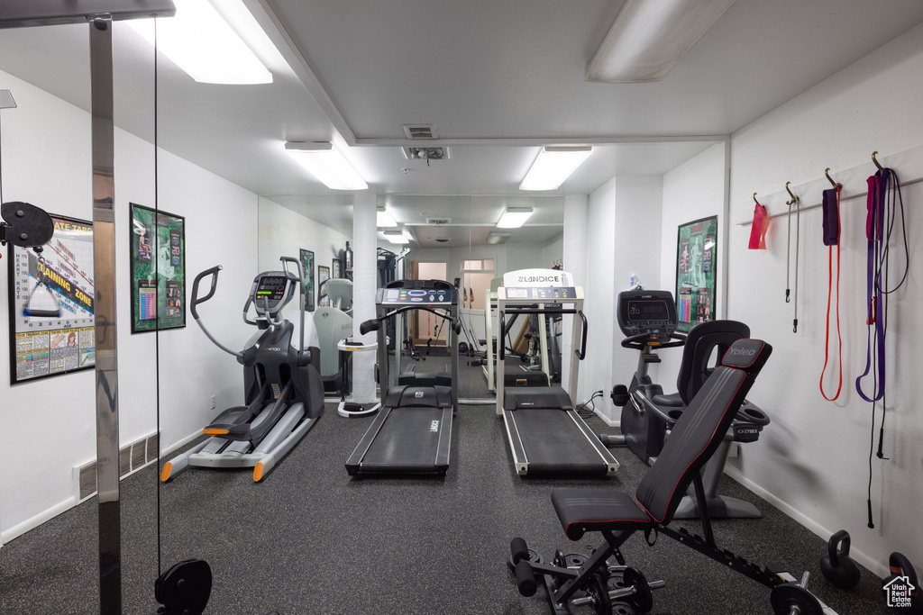 Exercise room featuring baseboards