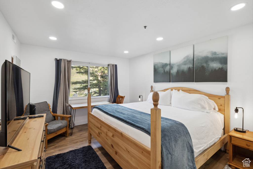 Bedroom with recessed lighting and wood finished floors