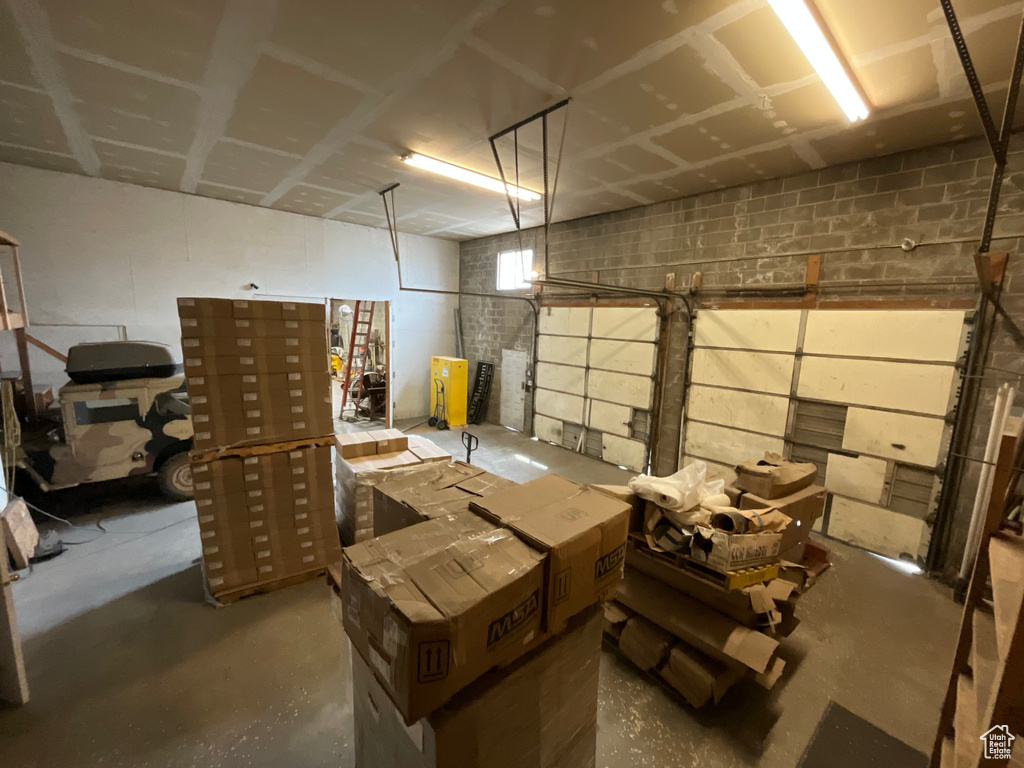 Garage featuring concrete block wall