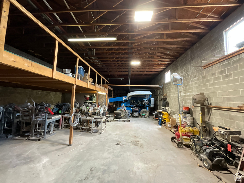 Garage featuring concrete block wall