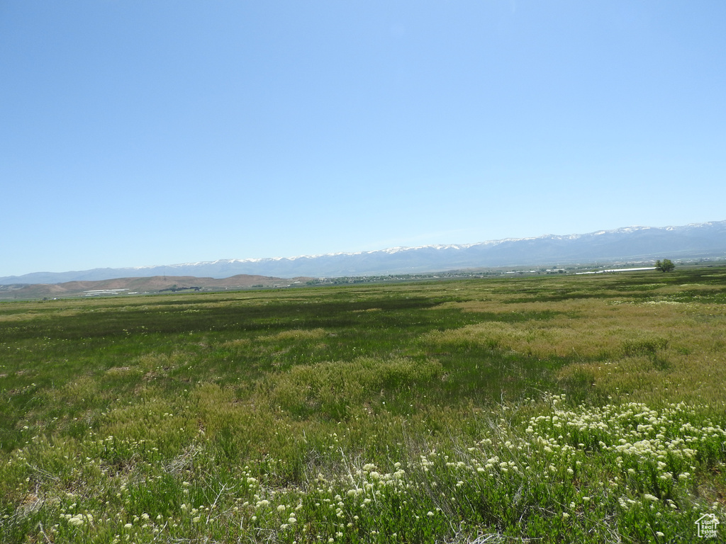 View of mountain background featuring rural landscape