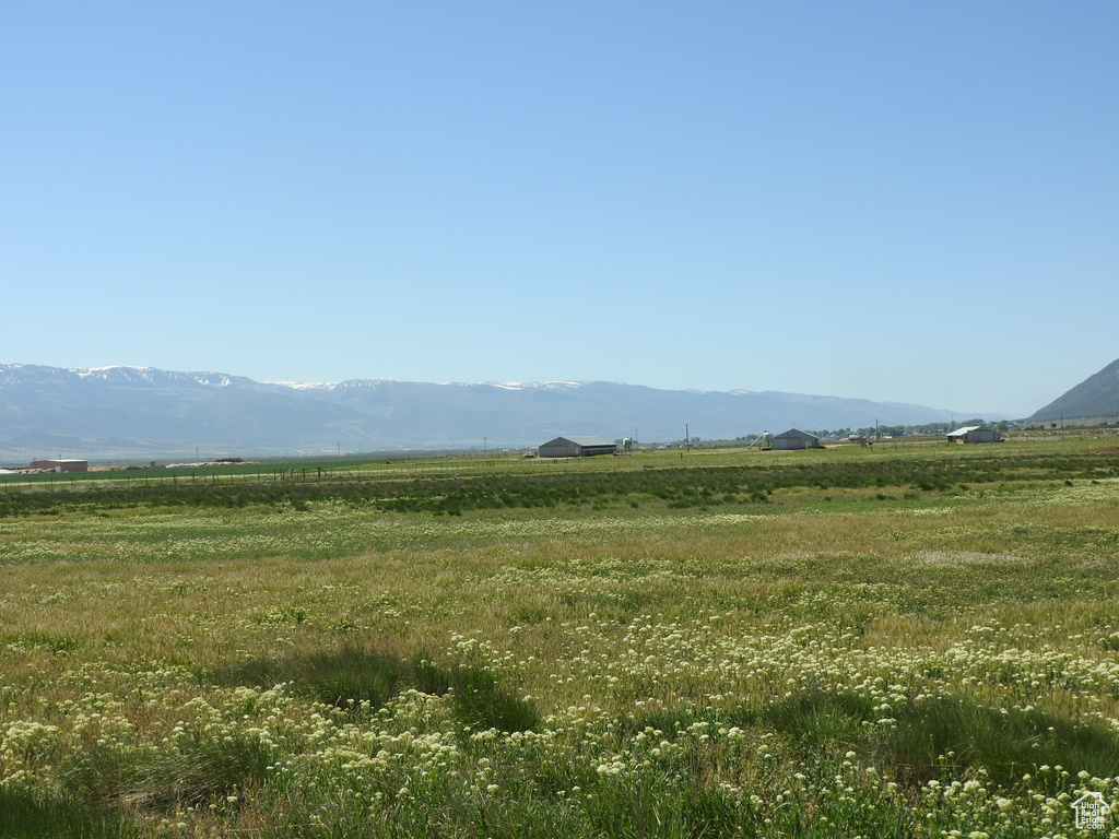 View of mountain backdrop with rural landscape