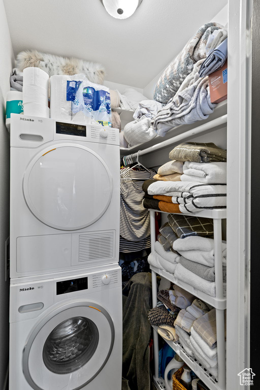 Laundry area with stacked washer / dryer