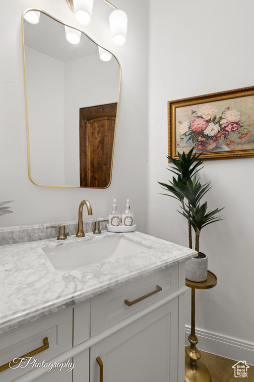 Bathroom with vanity and baseboards