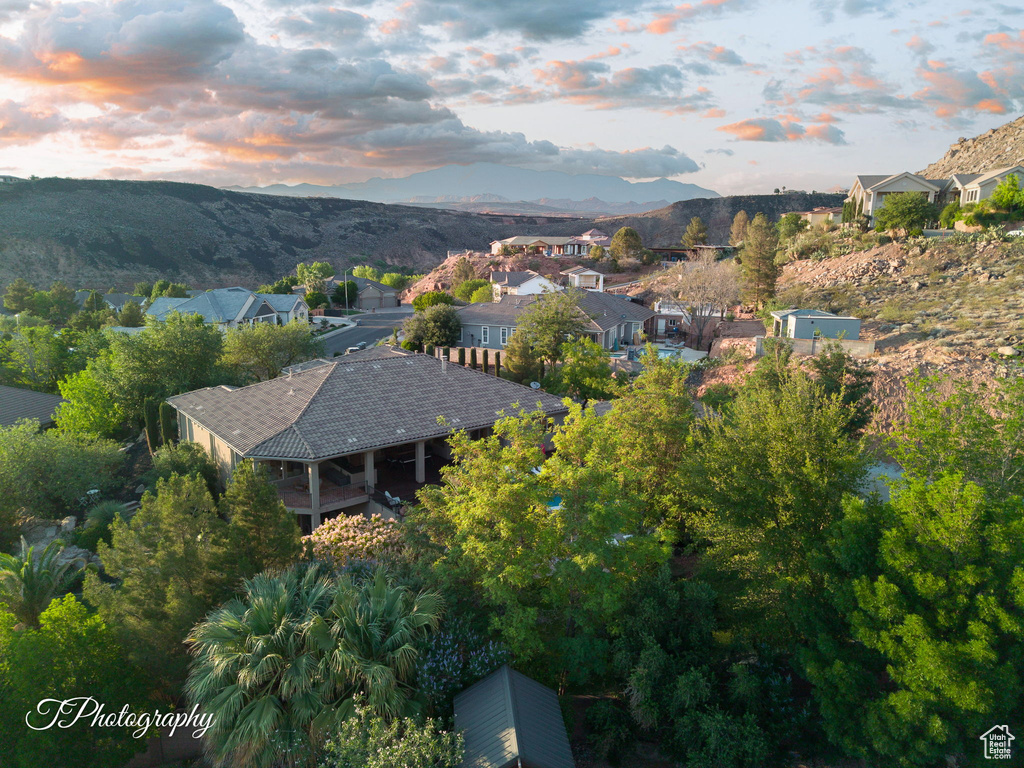 View of property location with a mountain backdrop and nearby suburban area
