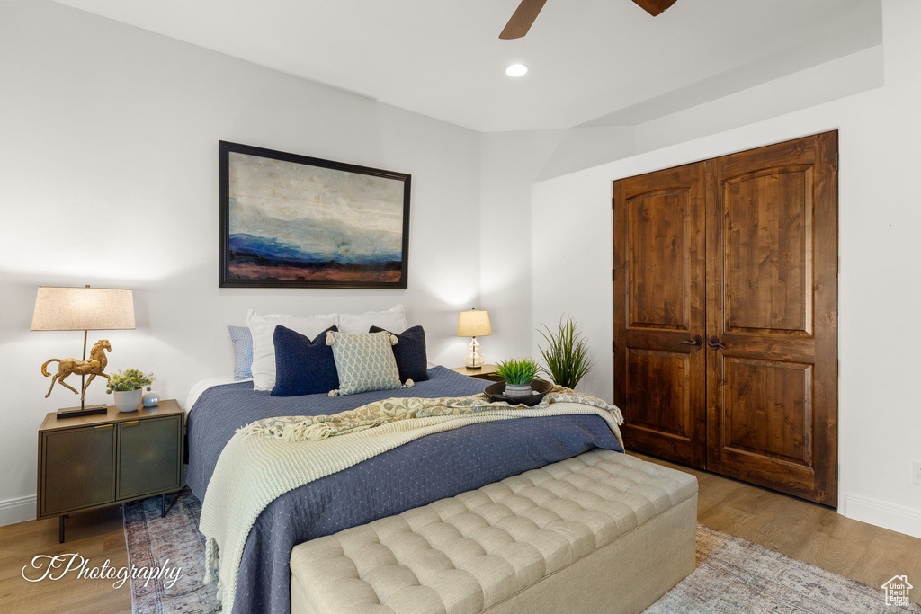 Bedroom featuring wood finished floors, baseboards, recessed lighting, and a ceiling fan