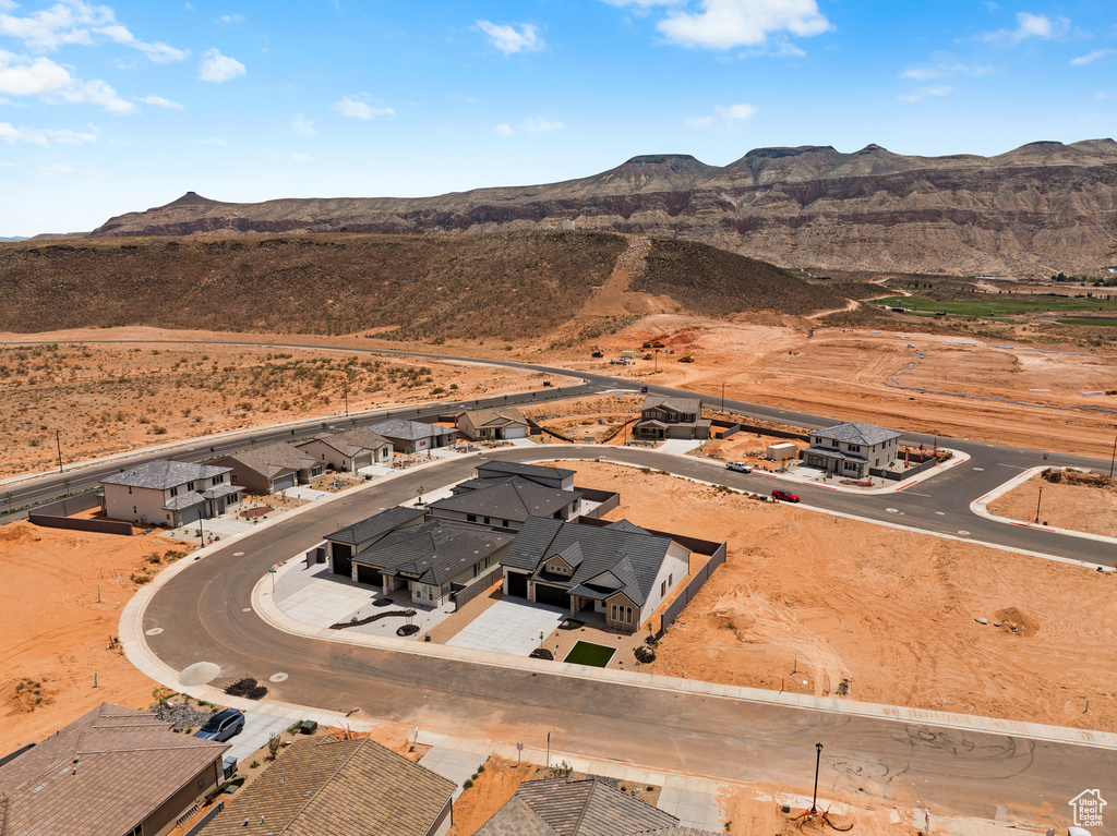 Drone / aerial view of a mountainous background and a desert landscape