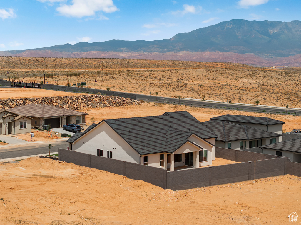 Aerial view of property and surrounding area with mountains and a desert landscape