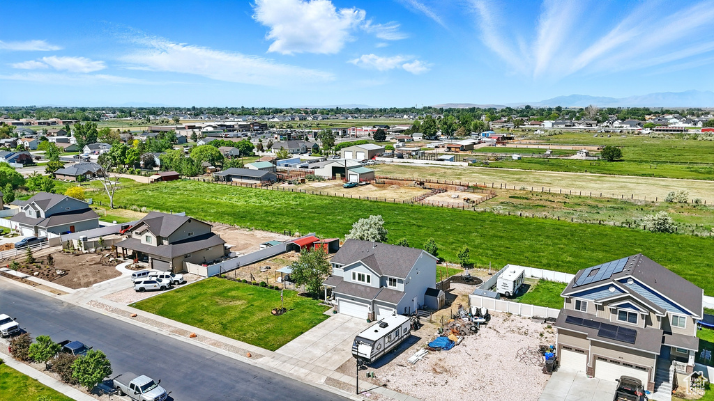 Aerial perspective of suburban area with a mountainous background